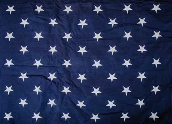 white stars of american flag on blue background